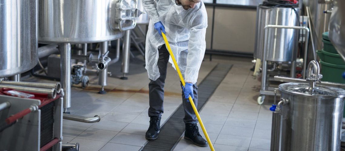 professional-cleaner-wearing-protection-uniform-cleaning-floor-production-plant (1)